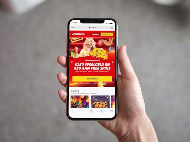 Anna holding an iphone and showing jacks nl site