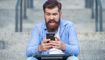 Man gambling on mobile device